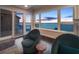 Inviting living area with cozy chairs and stunning ocean views at sunset at 340 Gulf Of Mexico Dr # 124, Longboat Key, FL 34228