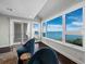 Bright living room featuring hardwood floors, large windows with scenic ocean views at 340 Gulf Of Mexico Dr # 124, Longboat Key, FL 34228