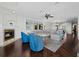 Spacious open-concept living area with plush seating, fireplace, and abundant natural light at 340 Gulf Of Mexico Dr # 124, Longboat Key, FL 34228