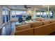 A cozy living room featuring a fireplace, comfortable seating, and stunning ocean views at 340 Gulf Of Mexico Dr # 124, Longboat Key, FL 34228