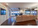 Comfortable living room with ocean view windows and a cozy fireplace at 340 Gulf Of Mexico Dr # 124, Longboat Key, FL 34228
