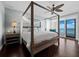 Spacious main bedroom boasts a four-poster bed and an ocean view at 340 Gulf Of Mexico Dr # 124, Longboat Key, FL 34228