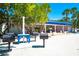 Outdoor barbecue area with grills and picnic tables, perfect for community gatherings at 340 Gulf Of Mexico Dr # 124, Longboat Key, FL 34228