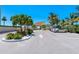 Well-maintained parking area with landscaping and access to community amenities at 340 Gulf Of Mexico Dr # 124, Longboat Key, FL 34228