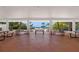 Community picnic area with tables providing a shaded spot overlooking a sandy beach at 340 Gulf Of Mexico Dr # 124, Longboat Key, FL 34228