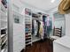 Organized walk-in closet with custom shelving, drawers, and hanging space at 340 Gulf Of Mexico Dr # 124, Longboat Key, FL 34228