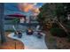 Fire pit and outdoor seating area offer a charming backyard space for relaxing or entertaining at 3667 Country Place Blvd, Sarasota, FL 34233