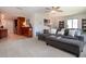 Cozy living room featuring a comfortable gray sectional and easy transition to kitchen and the rest of the home at 3667 Country Place Blvd, Sarasota, FL 34233