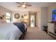 A relaxing main bedroom with carpet flooring, natural light, and a ceiling fan at 3667 Country Place Blvd, Sarasota, FL 34233
