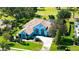 Beautiful aerial view of a home with mature trees, lush lawns and landscaping, and a well-manicured community at 3847 Little Country Rd, Parrish, FL 34219