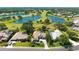 An aerial view showing the proximity of this home to the golf course and community lakes at 3847 Little Country Rd, Parrish, FL 34219