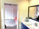 The bathroom features a marble countertop and access to the bedroom through a doorway at 3847 Little Country Rd, Parrish, FL 34219