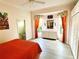 This light and bright bedroom features bay windows, and an ensuite bathroom at 3847 Little Country Rd, Parrish, FL 34219