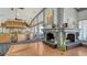 Dining room showcases fireplace, bar, tables, and chairs in a well-lit, spacious layout at 3847 Little Country Rd, Parrish, FL 34219