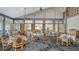 Spacious dining room with large windows, ample seating, and tasteful decor, perfect for hosting events at 3847 Little Country Rd, Parrish, FL 34219