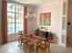Cozy dining area featuring a glass table, decorative chandelier, and bright walls at 3847 Little Country Rd, Parrish, FL 34219