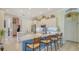 Stylish kitchen with a center island, white cabinetry, and stainless steel appliances at 3847 Little Country Rd, Parrish, FL 34219
