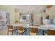 Spacious kitchen with a breakfast bar, modern appliances, and views into the living spaces at 3847 Little Country Rd, Parrish, FL 34219