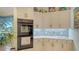 Bright kitchen with marble countertops, tile backsplash, and modern stainless steel appliances at 3847 Little Country Rd, Parrish, FL 34219