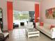 Bright living room with access to the lanai and views of the pool and backyard at 3847 Little Country Rd, Parrish, FL 34219