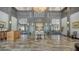 Grand lobby with marble floors, soaring ceilings, and elegant decor at 3847 Little Country Rd, Parrish, FL 34219