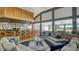 Comfortable lounge area adjacent to the bar features plush seating, stylish decor, and scenic golf course views at 3847 Little Country Rd, Parrish, FL 34219