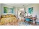Cozy office space with natural light, a colorful day bed, and charming decor with tranquil art at 3847 Little Country Rd, Parrish, FL 34219