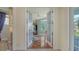 Elegant home office with french doors, tile flooring, and bright natural light from the windows at 3847 Little Country Rd, Parrish, FL 34219