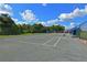 Enjoy a game of tennis on this well-maintained outdoor court, perfect for recreational fun and exercise in the community at 3847 Little Country Rd, Parrish, FL 34219
