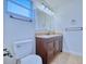 Bright bathroom with a modern vanity, ample storage, and tiled floors at 3904 Ashwood Ln, Sarasota, FL 34232