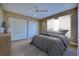 Cozy bedroom featuring plush bedding, neutral tones, and a ceiling fan at 3904 Ashwood Ln, Sarasota, FL 34232