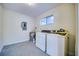 Functional laundry room with washer, dryer, and convenient utility connections at 3904 Ashwood Ln, Sarasota, FL 34232