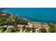 Stunning waterfront property with lush landscaping and beautiful views of the bay at 404 S Shore Dr, Sarasota, FL 34234