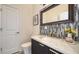 Stylish bathroom featuring a vanity with marble countertop and decorative backsplash at 404 S Shore Dr, Sarasota, FL 34234