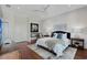Bright bedroom featuring a large decorative painting and two bedside lamps at 404 S Shore Dr, Sarasota, FL 34234
