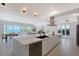 Open-concept kitchen with a large island, modern appliances, and stunning water views from every angle at 404 S Shore Dr, Sarasota, FL 34234