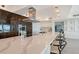 Modern kitchen with a large island, high-end appliances, and sleek cabinetry with water views at 404 S Shore Dr, Sarasota, FL 34234