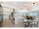 Bright, open kitchen with stainless steel appliances, modern cabinetry, and a seamless flow into the living space at 404 S Shore Dr, Sarasota, FL 34234