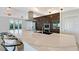 Well-appointed kitchen featuring a spacious island, stainless steel appliances, and stylish pendant lighting at 404 S Shore Dr, Sarasota, FL 34234