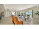 Bright living room with stylish seating, an elegant rug, and access to an outdoor patio with water views at 404 S Shore Dr, Sarasota, FL 34234