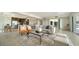 Inviting open-concept living space with modern furnishings, flowing into the kitchen and dining area at 404 S Shore Dr, Sarasota, FL 34234