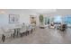 Bright and airy living room and dining area with sleek tile floors and water views at 404 S Shore Dr, Sarasota, FL 34234