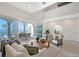 Modern living room with high ceilings, neutral tones, and seamless access to the patio at 404 S Shore Dr, Sarasota, FL 34234