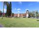 Well-maintained condo complex featuring lush green lawns and ample parking at 4206 Heron Way # B305, Bradenton, FL 34205