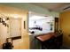 Open view of kitchen area with bright lighting, and breakfast bar seating at 4206 Heron Way # B305, Bradenton, FL 34205