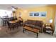Inviting living and dining area with bright, airy design and modern ceiling fan at 4206 Heron Way # B305, Bradenton, FL 34205
