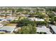 Spacious suburban home with a fenced backyard and an inviting pool area, captured from an aerial perspective at 440 Redwood Rd, Venice, FL 34293