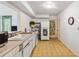 Functional kitchen with laminate floors, classic appliances, and ample counter space at 440 Redwood Rd, Venice, FL 34293