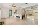 Spacious living room featuring terrazzo floors and easy access to other rooms at 440 Redwood Rd, Venice, FL 34293