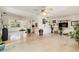 Spacious living room with polished floors, ceiling fans, and bright, natural light at 440 Redwood Rd, Venice, FL 34293